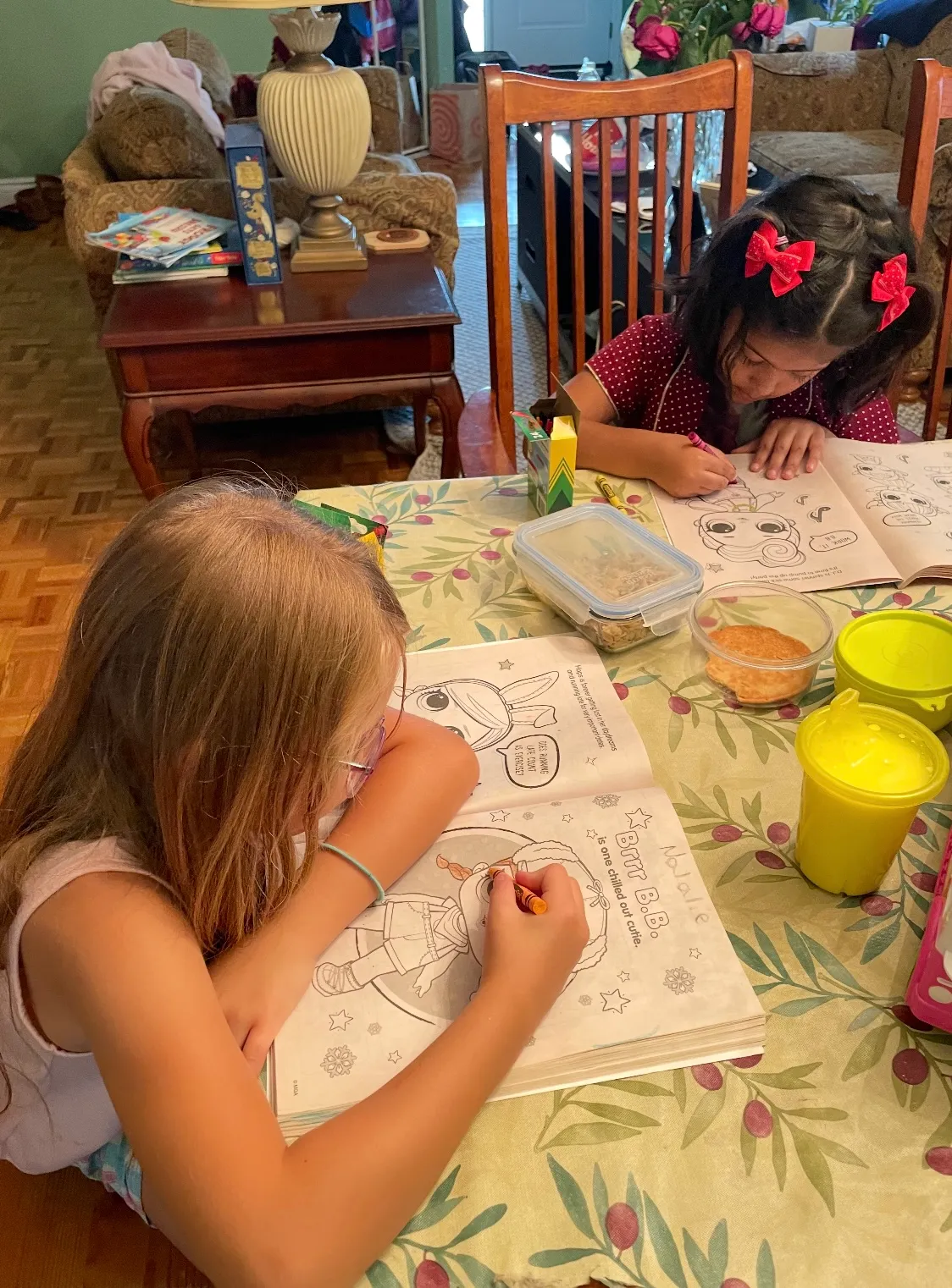 Photo of daycare kids coloring in workbooks